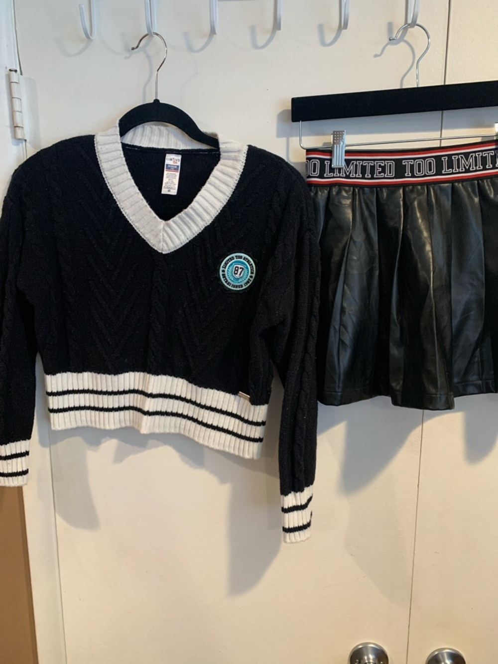 Kids Knit V-Neck Sweater with White Trim and Crest and Black Skirt